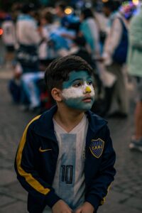 Portrait of Boy with Flag of Argentina on Face