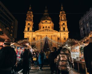 people gathered outside buildings at night