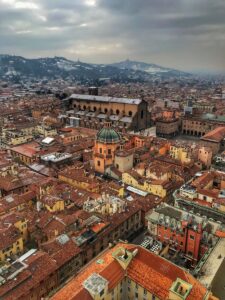 Stunning aerial view of Bologna featuring historic architecture and terracotta rooftops.