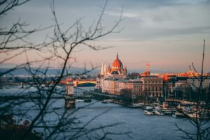 high-angle photography of dome building near bridge and body of water